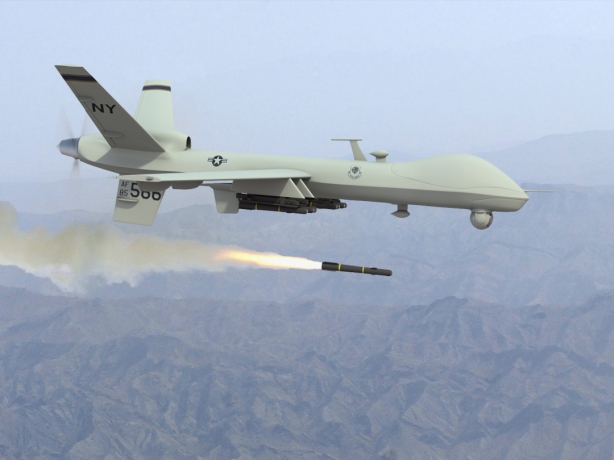 An American Predator drone fires a missile. 